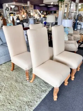 Beige upholstered armless dining chair
