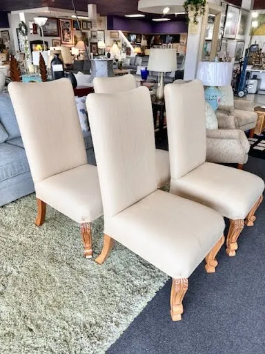 Beige upholstered armless dining chair